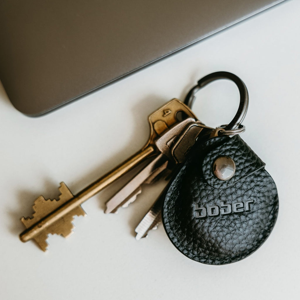 BOBER in its black leather pouch on a set of keys